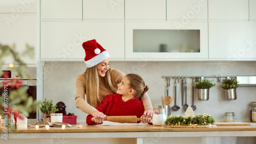 Mom And Daughter Baking Christmas Gingerbread Cookies In A Modern Kitchen. Banner, copy space