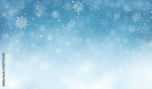 A beautiful winter scene with falling snowflakes and a soft blue gradient background.