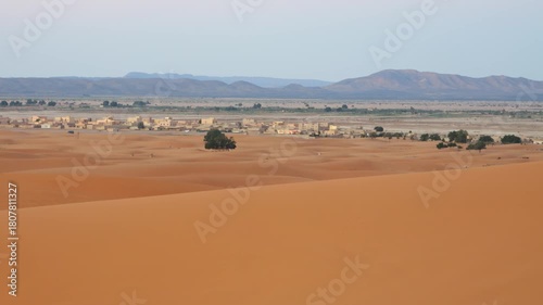 Video of Merzouga in Morocco, featuring the golden Sahara dunes, desert landscape, and peaceful natural scenery.