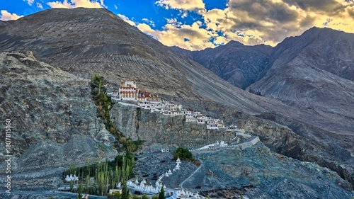 Stunning Diskit Monastery, an ancient Buddhist gompa, stands isolated on rocky hill in Nubra Valley, representing spiritual resilience in high Himalayas. Ladakh Region, India
