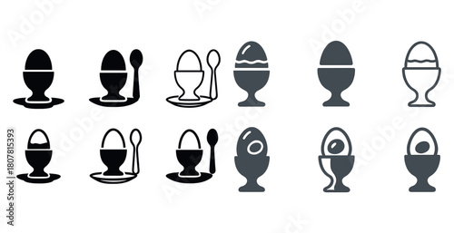Collection of egg cups with spoons in monochrome silhouettes