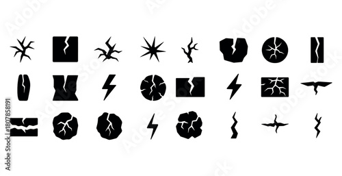Collection of black crack and lightning bolt silhouettes on white background