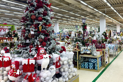 Preparation for Christmas and New year winter holiday concept. Sale of Christmas decorations in shopping mall. Store of Christmas symbols and accessories.