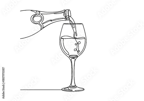 Champagne being poured into a flute glass for celebration concept of Christmas and New Year  