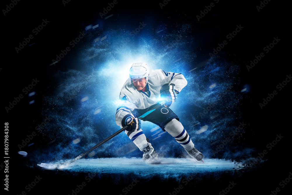 Obraz premium Hockey. Hockey players on a beautiful black background with a flash of light behind them. Isolated on a black background. Sports