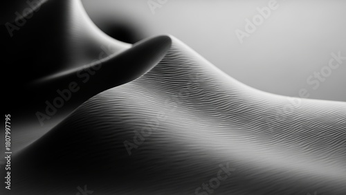 Fototapeta Naklejka Na Ścianę i Meble -  Abstract black and white image of sand dunes resembling a human form.