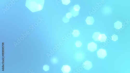 Abstract blue bokeh background with soft light effects.