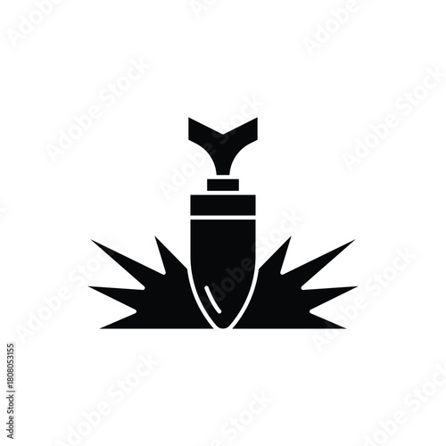 Black silhouette of a bullet striking a surface with an explosive impact.