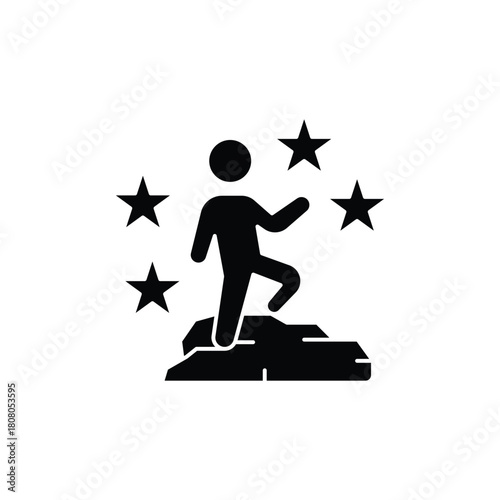 Black silhouette icon of a person achieving success, standing on a rock surrounded by stars, symbolizing accomplishment and recognition.