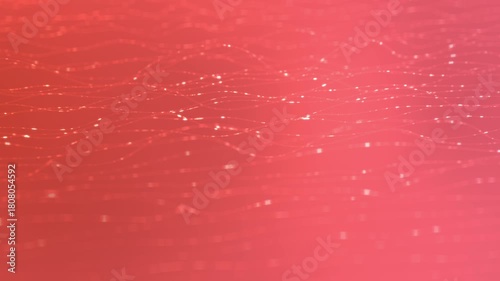 Abstract Sparkling Particles on a Red Gradient Background.