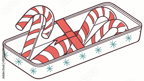 Candy canes in a decorated tin box with a red ribbon tied around them for a festive holiday treat