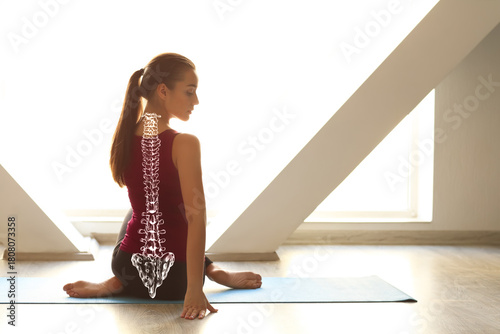 Young woman practicing yoga...