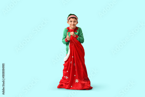 Cute little elf with Santa ...