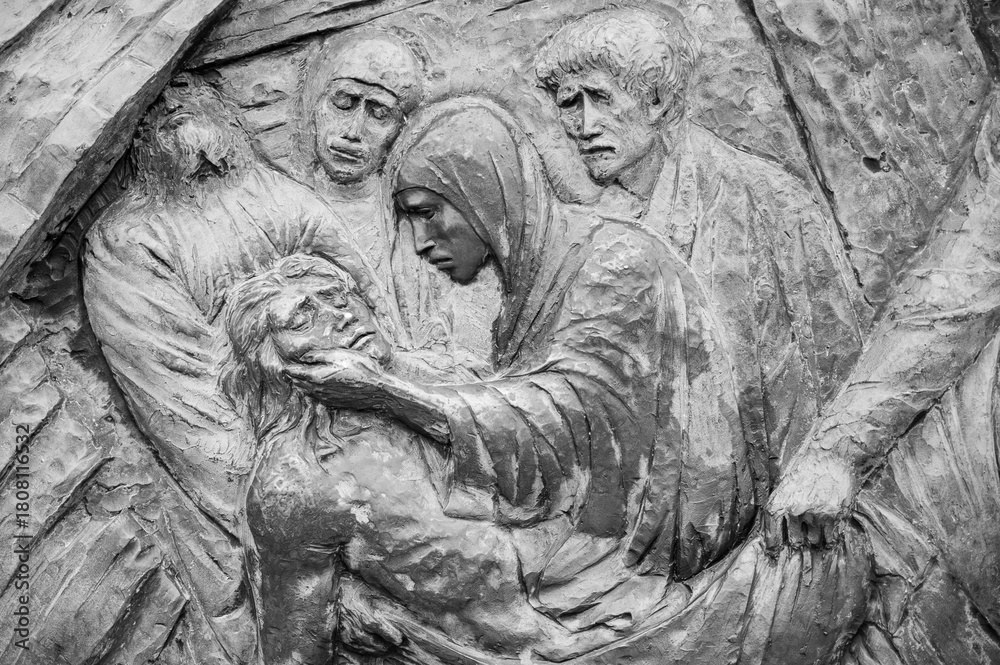 Fototapeta premium Station XIV: Jesus is laid in the tomb. The Way of the Cross on Mount Križevac (the Cross Mountain) in Medjugorje.