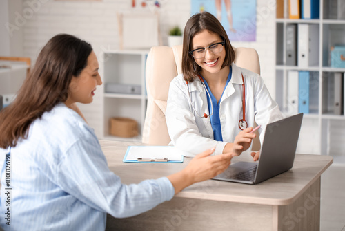 Happy young female doctor w...