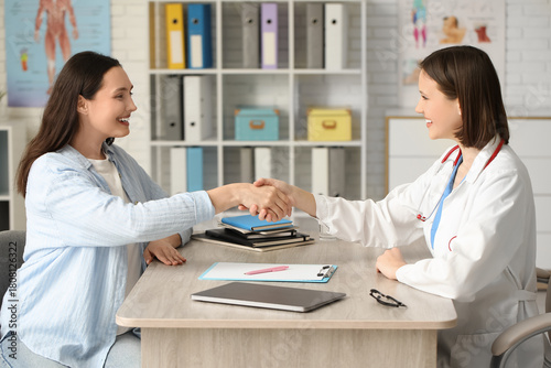 Happy young female doctor w...