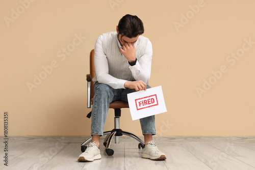 Upset young man holding pap...