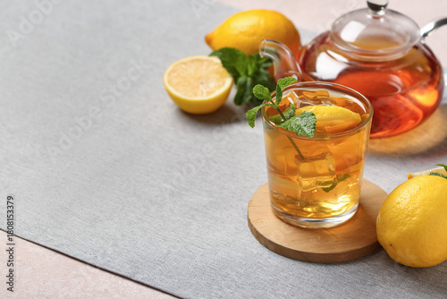 Glass and teapot of lemon i...