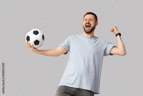 Happy young man with soccer...