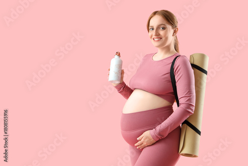 Sporty young pregnant woman...