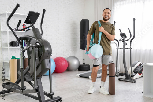 Young man with sports bag a...