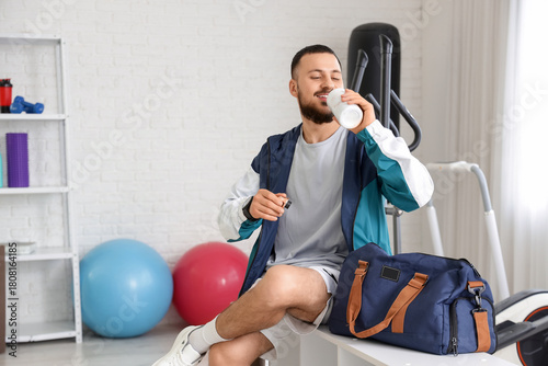 Young man with sports bag d...