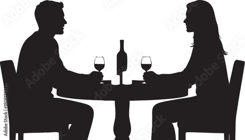 Silhouette of couple having romantic dinner with wine