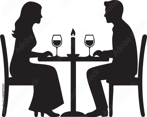 Silhouette of couple having romantic dinner with candle