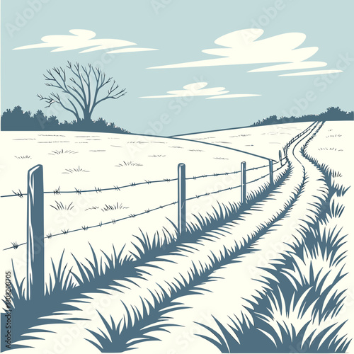 A winding dirt road through a field with a barbed wire fence