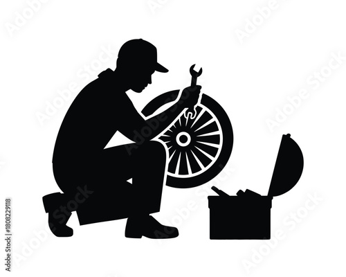 Mechanic working on wheel with tools worker repair