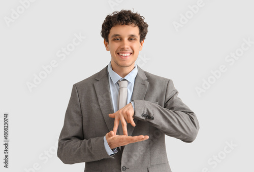 Young businessman using sig...
