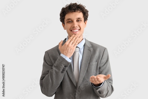 Young businessman using sig...