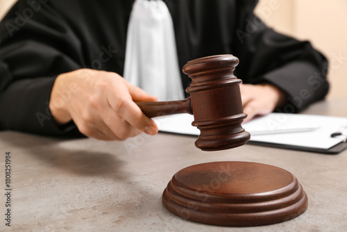 Female judge with gavel and...