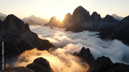 Majestic mountain landscape with sunrise above the clouds in winter travel  