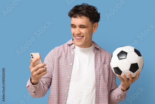 Happy young man with mobile...