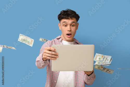 Shocked young man with lapt...