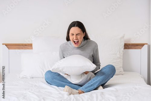 Screaming young woman with ...