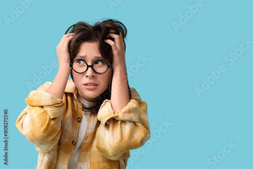 Scared young woman in eyegl...