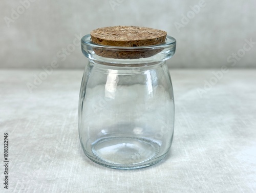 Close-up of a Glass Storage Jar with Cork Lid in Soft Natural Light
