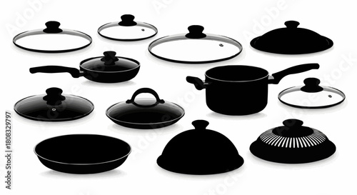 Collection of various black and white cooking pot lids and pans.