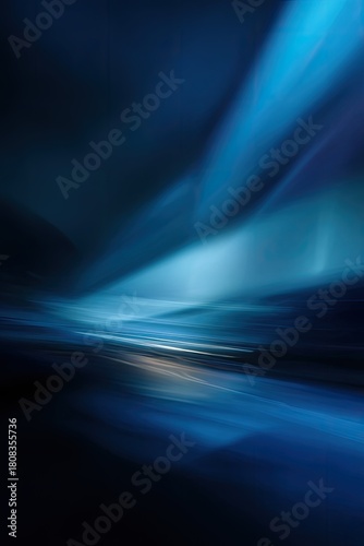 Abstract flowing streaks of blue and black light across a landscape