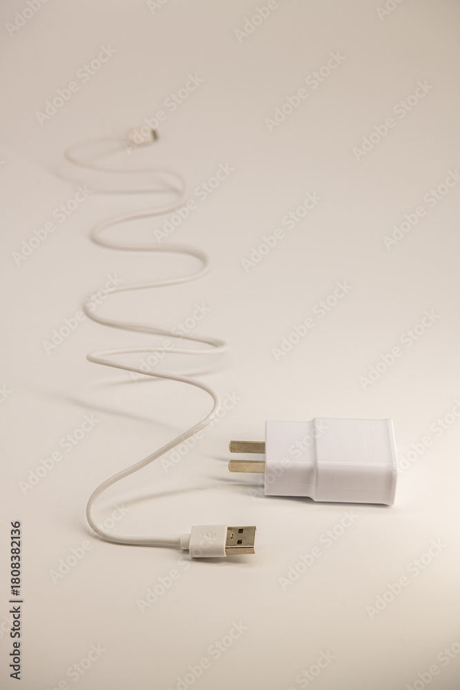 Fototapeta premium USB cable on a white background. A white prod for the phone