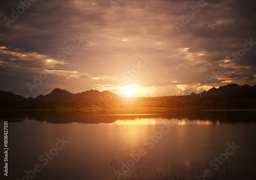 The last light of the day over the water, Sunset and its reflection