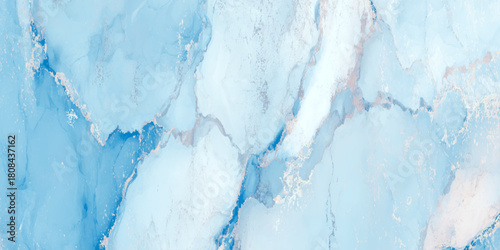 Bright cyan blue flowing alcohol ink abstract background with darker vein like marble texture with a smooth marble surface.