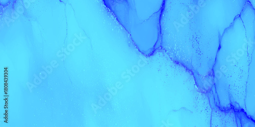 Bright cyan blue flowing alcohol ink abstract background with darker vein like marble texture with a smooth marble surface.