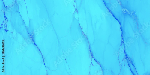 Bright cyan blue flowing alcohol ink abstract background with darker vein like marble texture with a smooth marble surface.