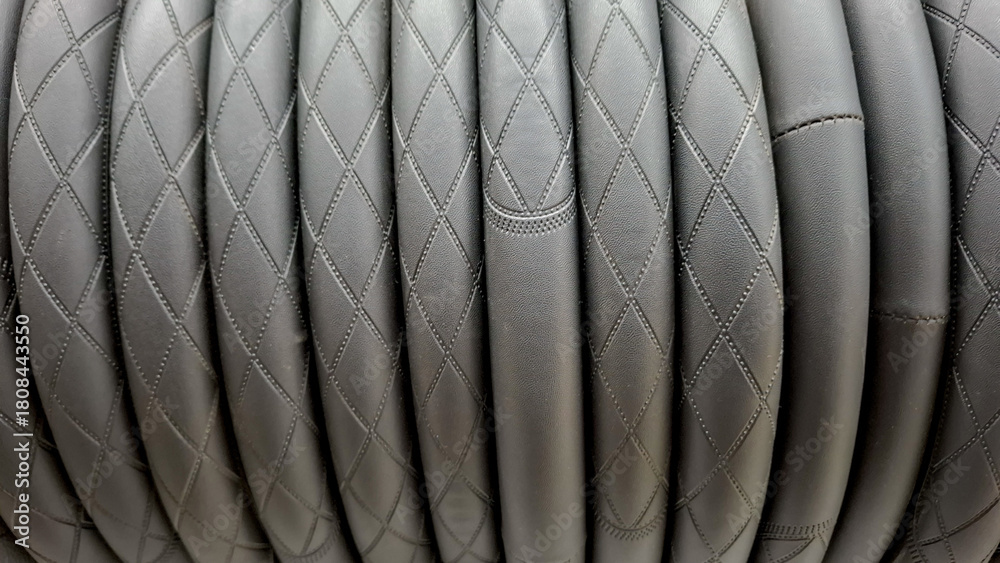 Obraz premium Black Quilted Leather Upholstery with Padded Vertical Channels