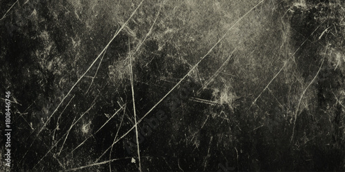 Dark grunge texture background with heavy diagonal scratches and distressed worn surface black and white vintage overlay.