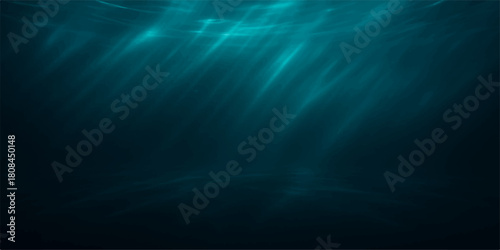 Blue abstract background with bright rays of light like underwater motion in the deep dark ocean