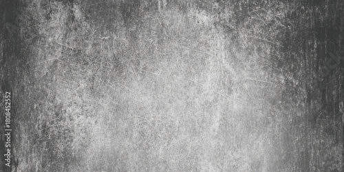 Dark grunge texture background distressed aged cracked concrete or stone wall surface with scratches and splatters monochrome design element.